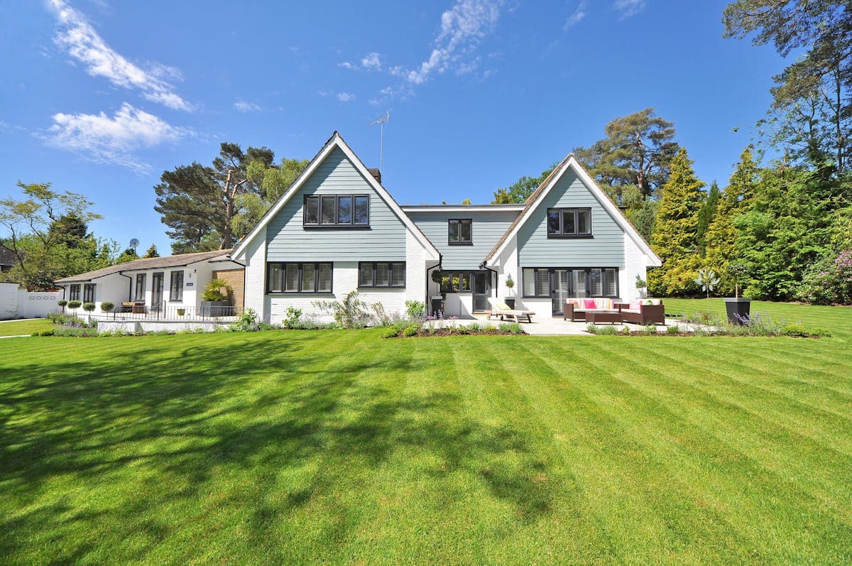Well-kept New England home exterior with manicured lawn
